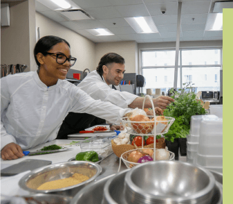 Two chefs developing recipes in the culinary innovation kitchen